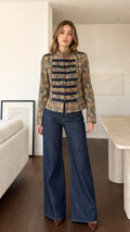 Front view of model wearing Bronze Multi jacquard military band jacket with wide-leg jeans