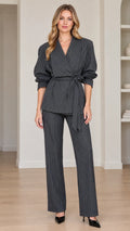 Full front view of women's charcoal grey pinstripe wrap blazer and trousers suit set