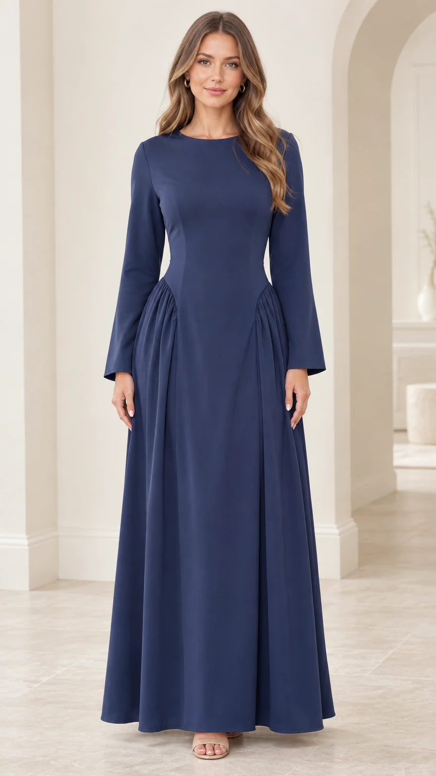 Front view of woman wearing navy blue long sleeve corset back maxi dress