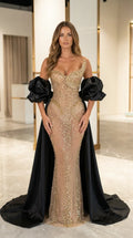 Champagne gold crystal embellished mermaid evening gown with black cape and puff sleeves front view