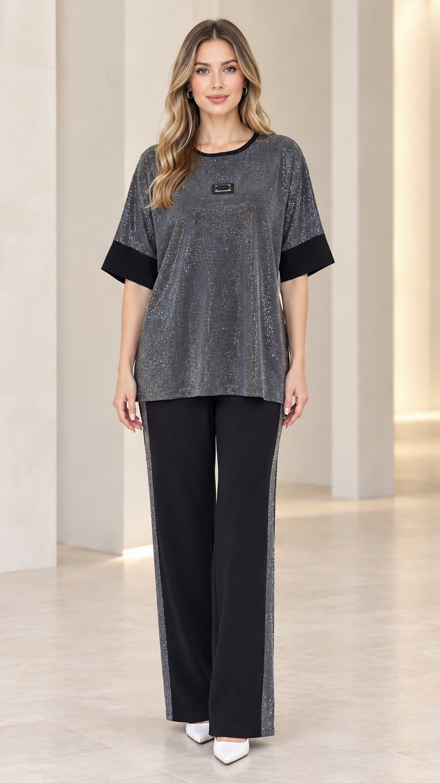 Front full-length view of model wearing charcoal shimmer knit top and wide leg pants set