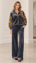 Women's charcoal velvet tracksuit set front view showing floral embroidered sleeves