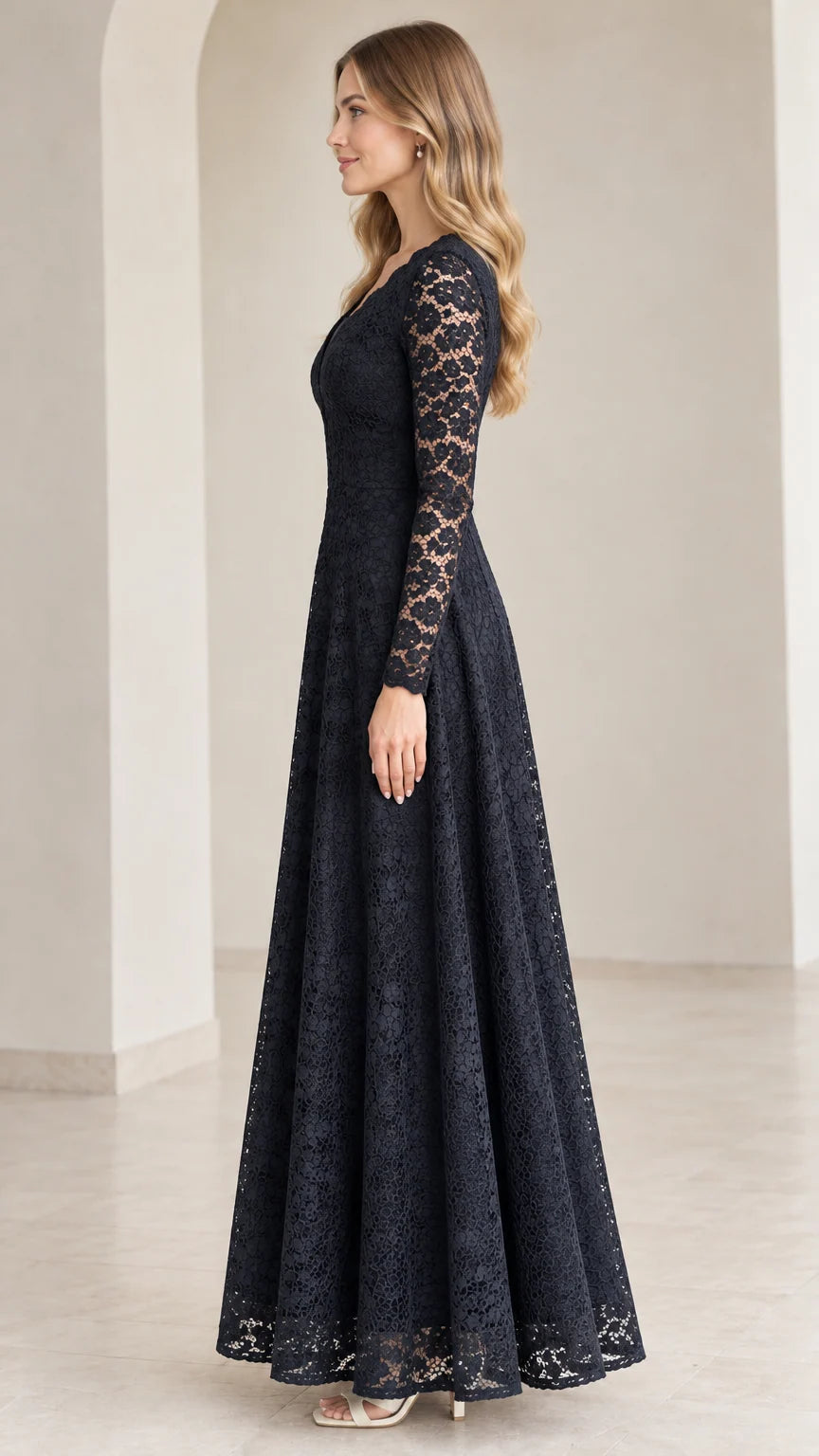 Side angle view of model wearing Navy Blue floral lace evening gown
