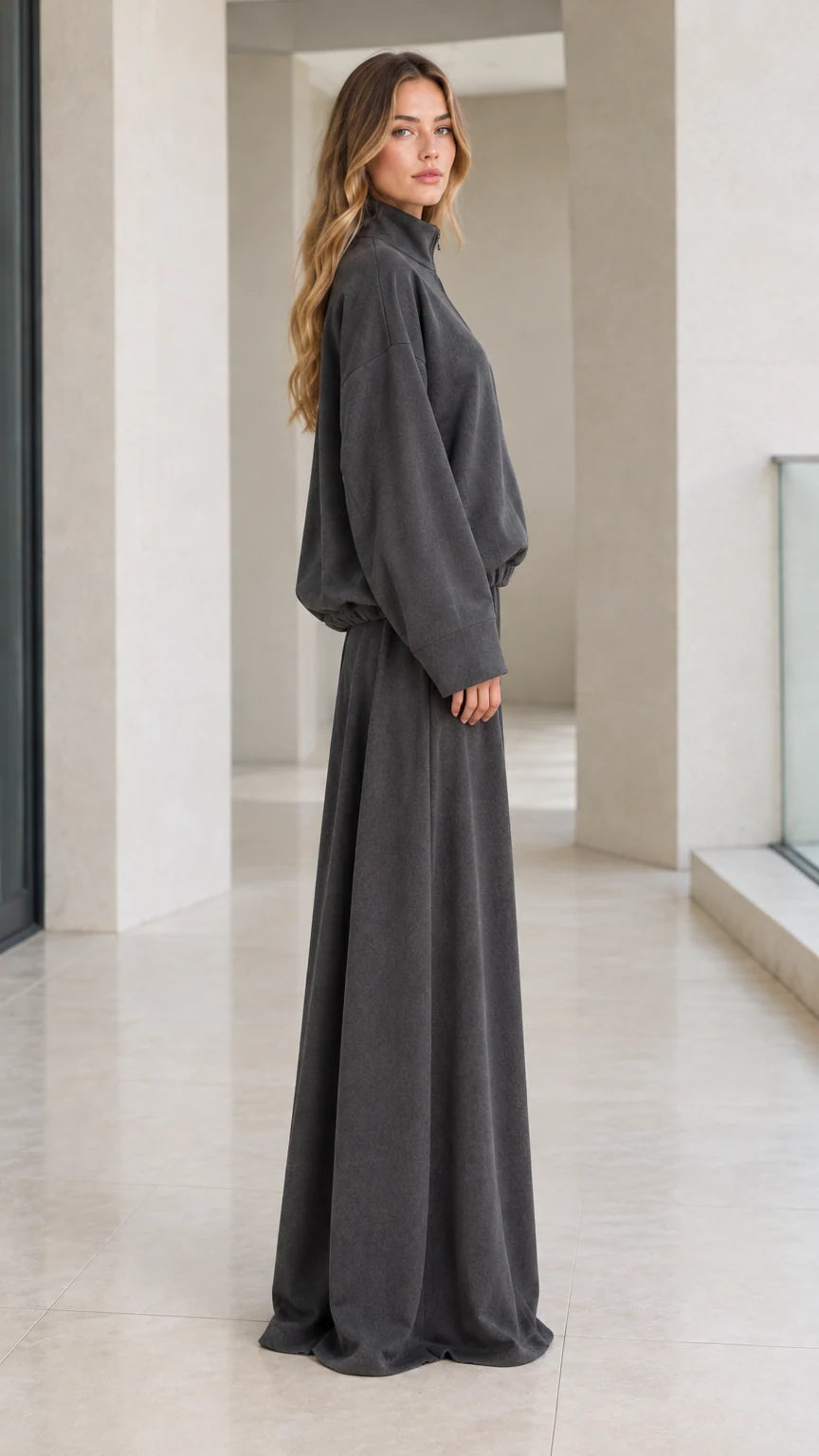 Side profile view of woman modeling charcoal grey two-piece wide-leg lounge set