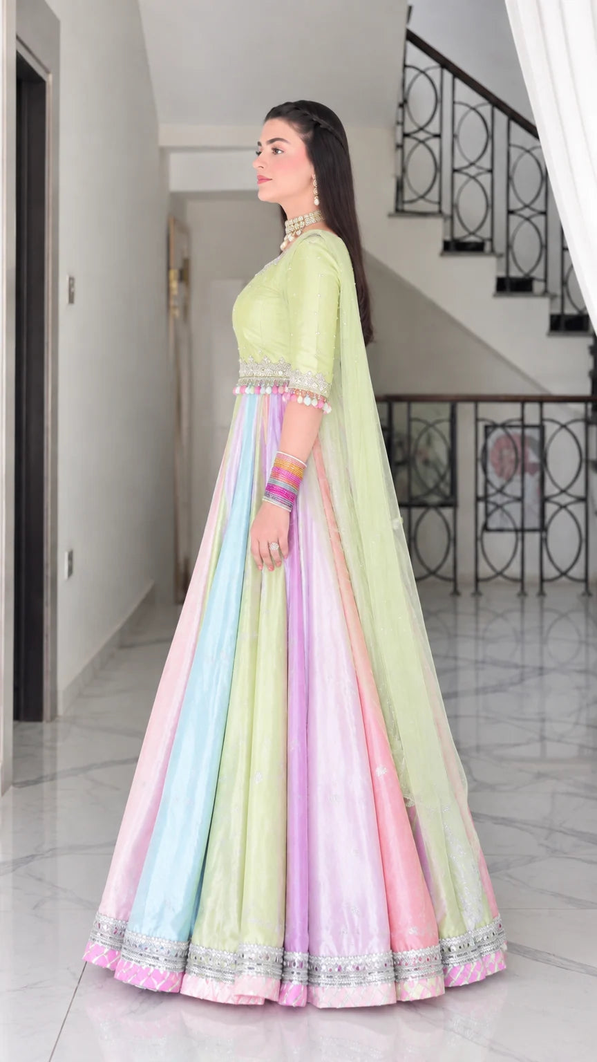 Side profile of lime green pastel paneled festive maxi gown with dupatta