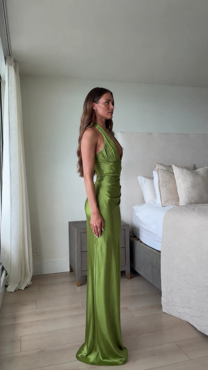 Side profile view of olive green ruched satin formal evening dress