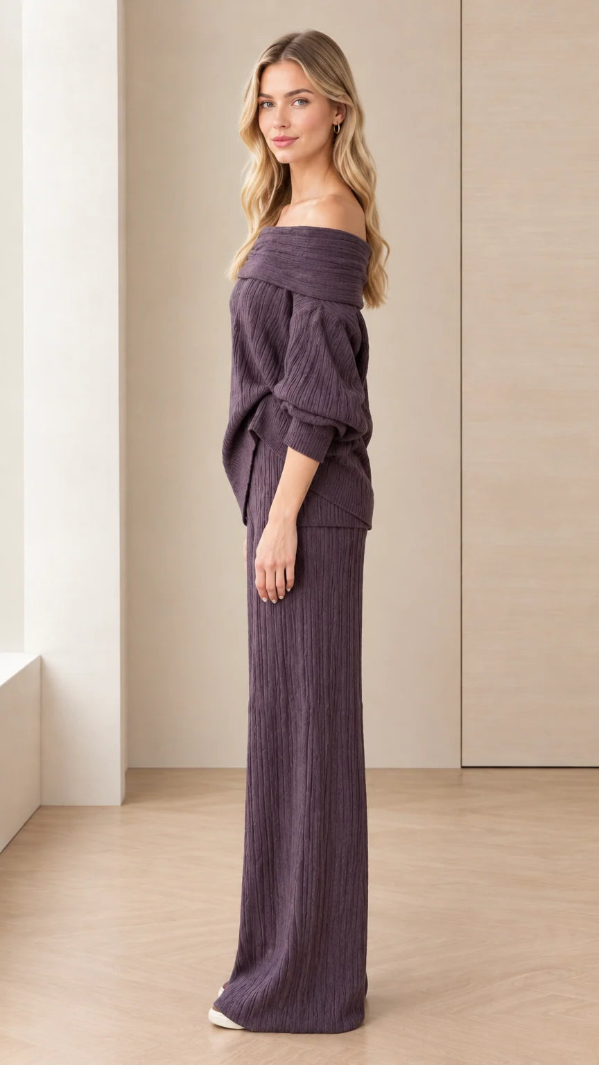 Side angle view of model posing in dark plum two-piece knit lounge outfit