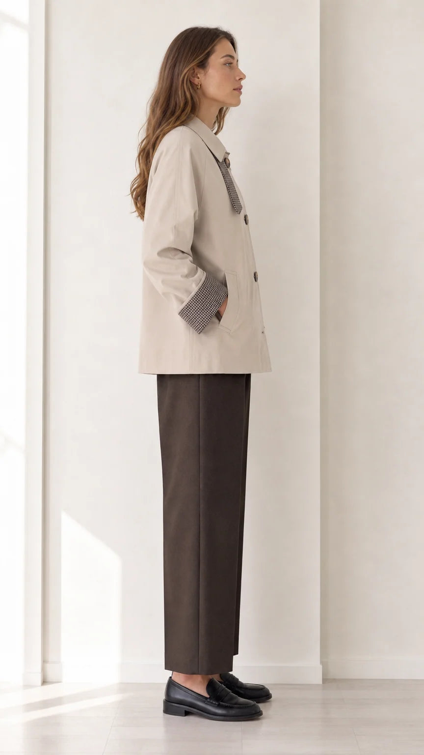 Side profile of women's beige short button-front jacket with plaid cuff accent