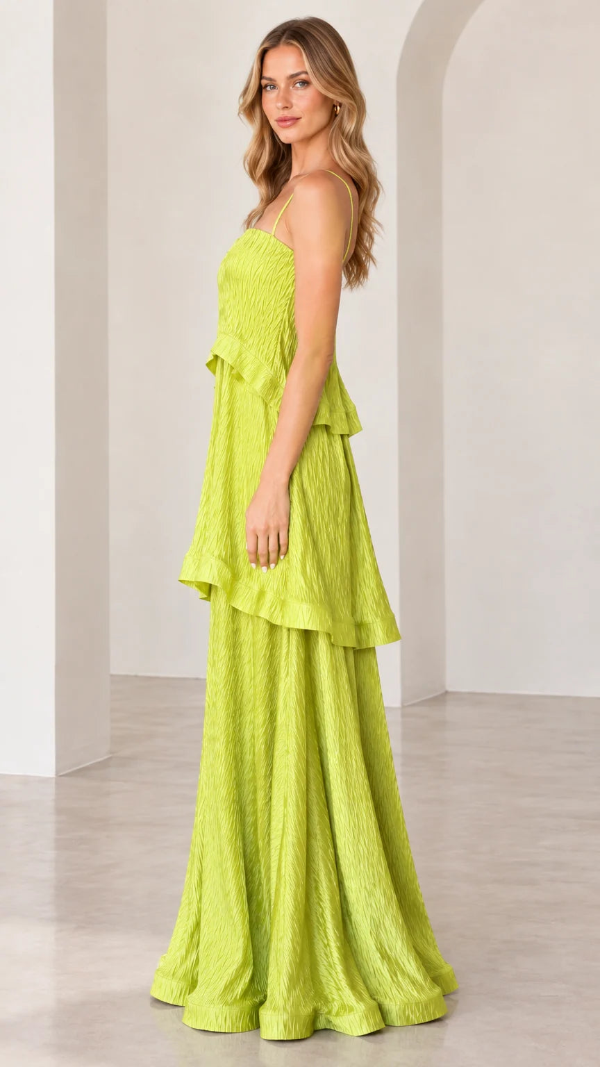 Side profile view of chartreuse tiered maxi dress showcasing draped tiers