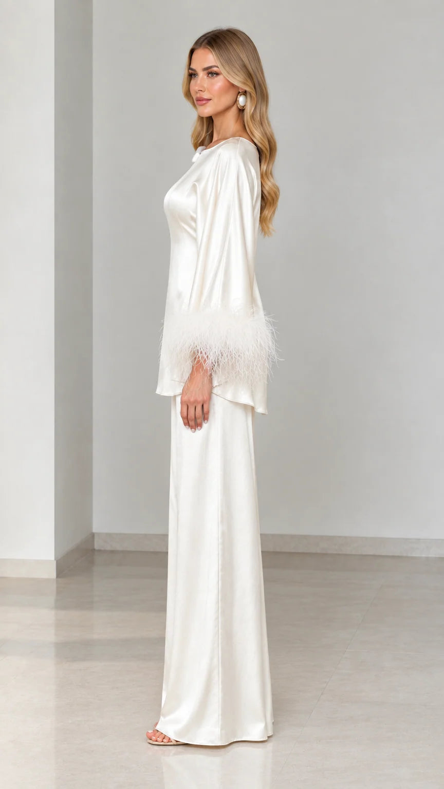 Side profile view of ivory satin tunic and wide-leg pant set