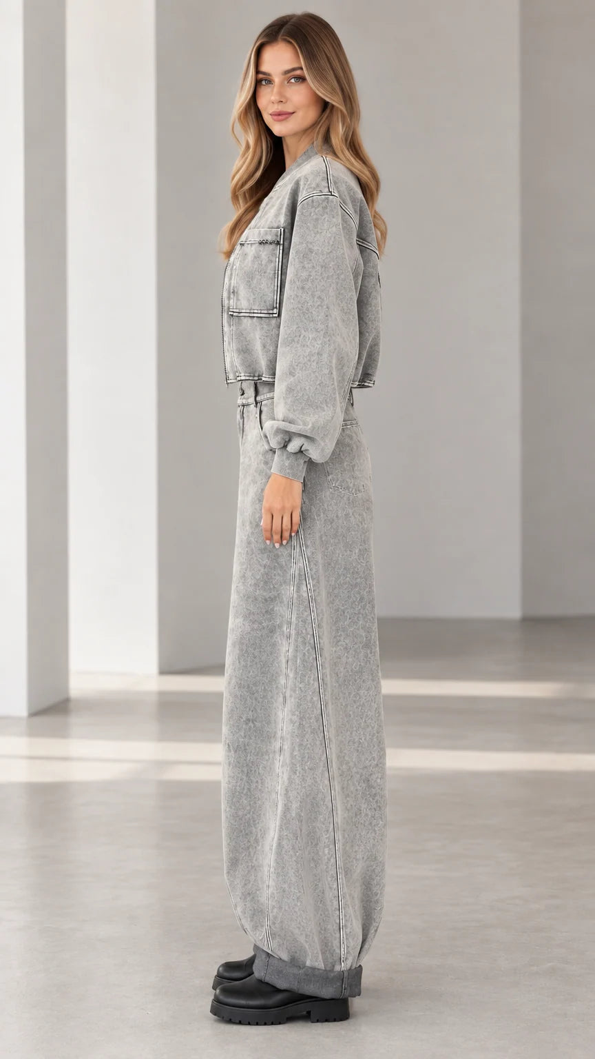 Side profile view of grey acid wash denim two-piece jacket and jeans set