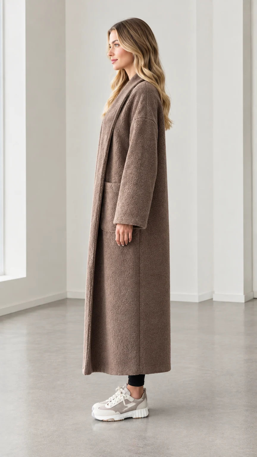 Side profile view of model wearing mocha textured longline open front duster coat
