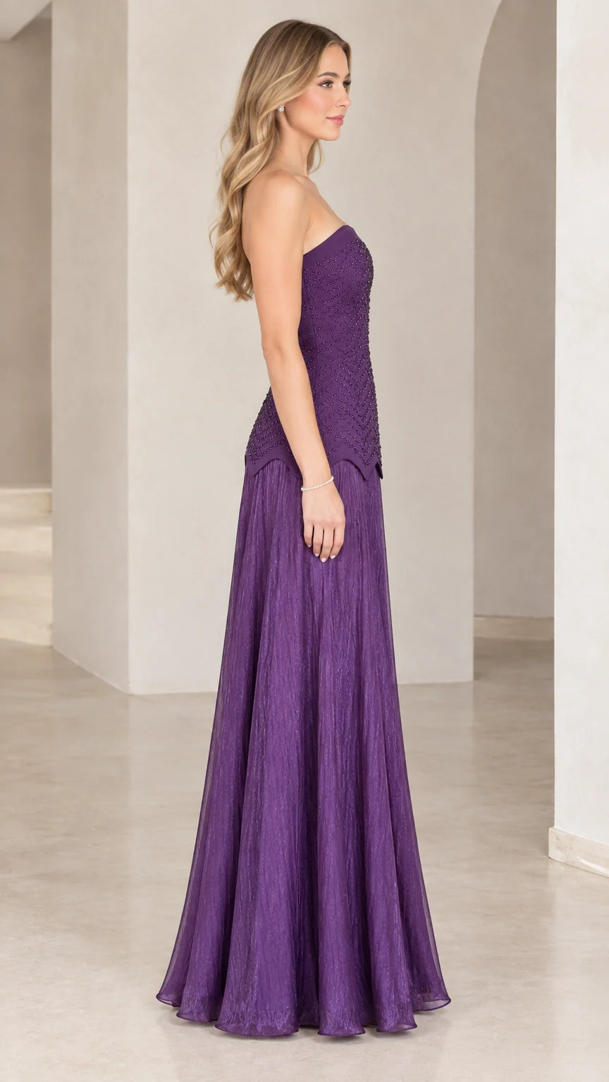 Side profile view of purple strapless beaded evening gown