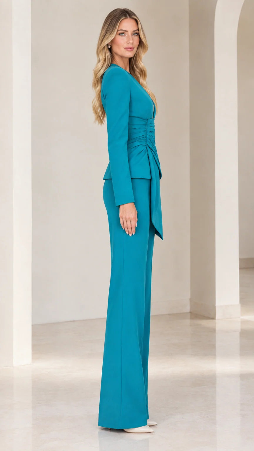 Side profile of woman wearing teal tailored two-piece pant suit set