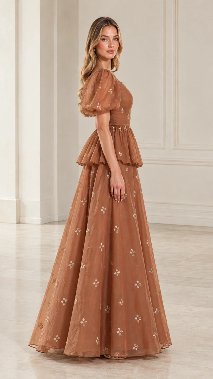 Side profile view of woman modeling toffee brown sheer sleeve formal evening dress