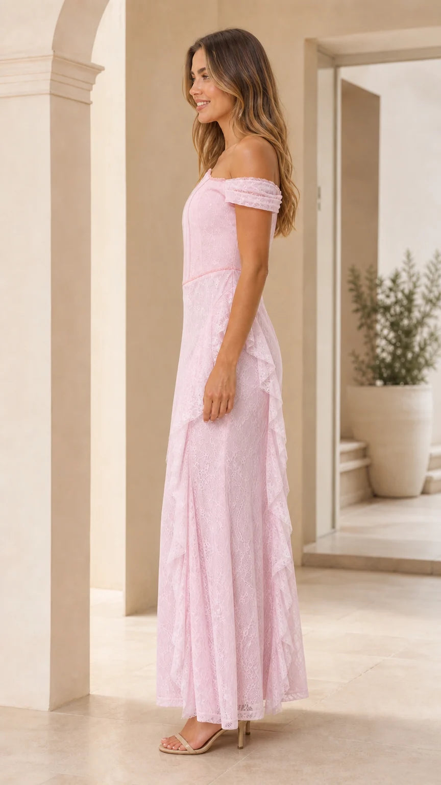 Side profile view of pink lace maxi dress