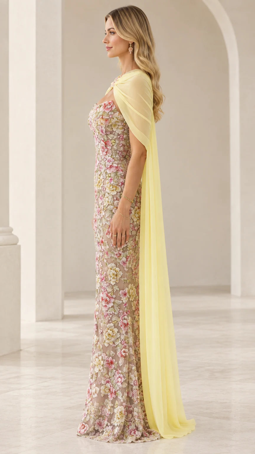 Pastel yellow floral embroidered gown side profile showing capelet drape