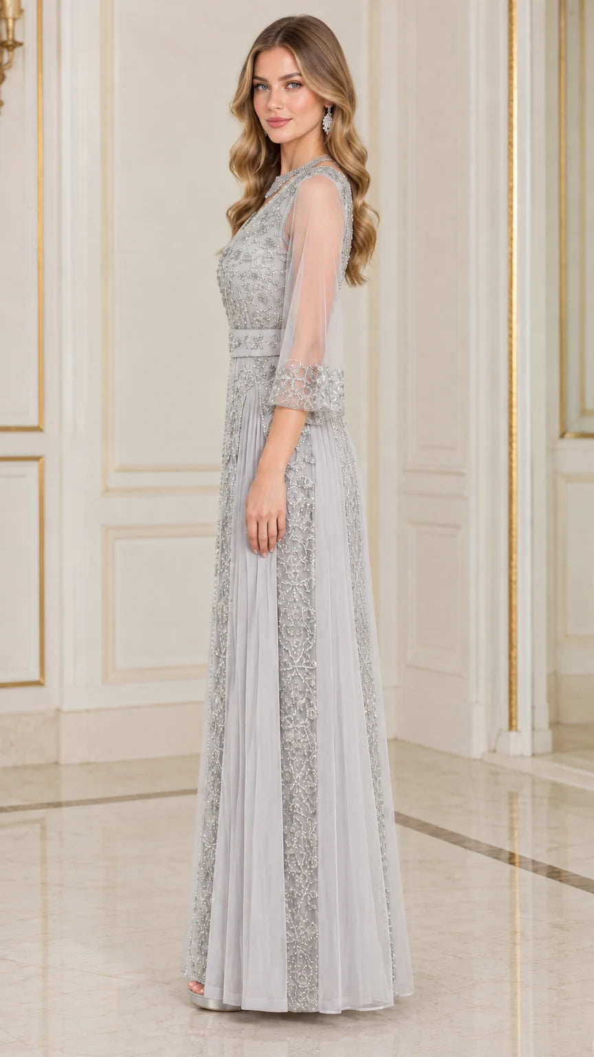 Side profile view of silver grey beaded A-line formal maxi dress with sheer sleeves