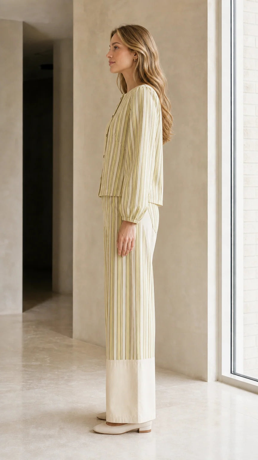 Side view of woman wearing sage striped matching set