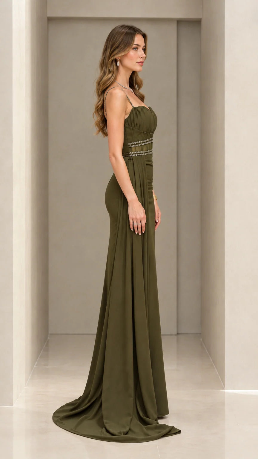 Side profile of olive green floor-length evening dress with sweep train
