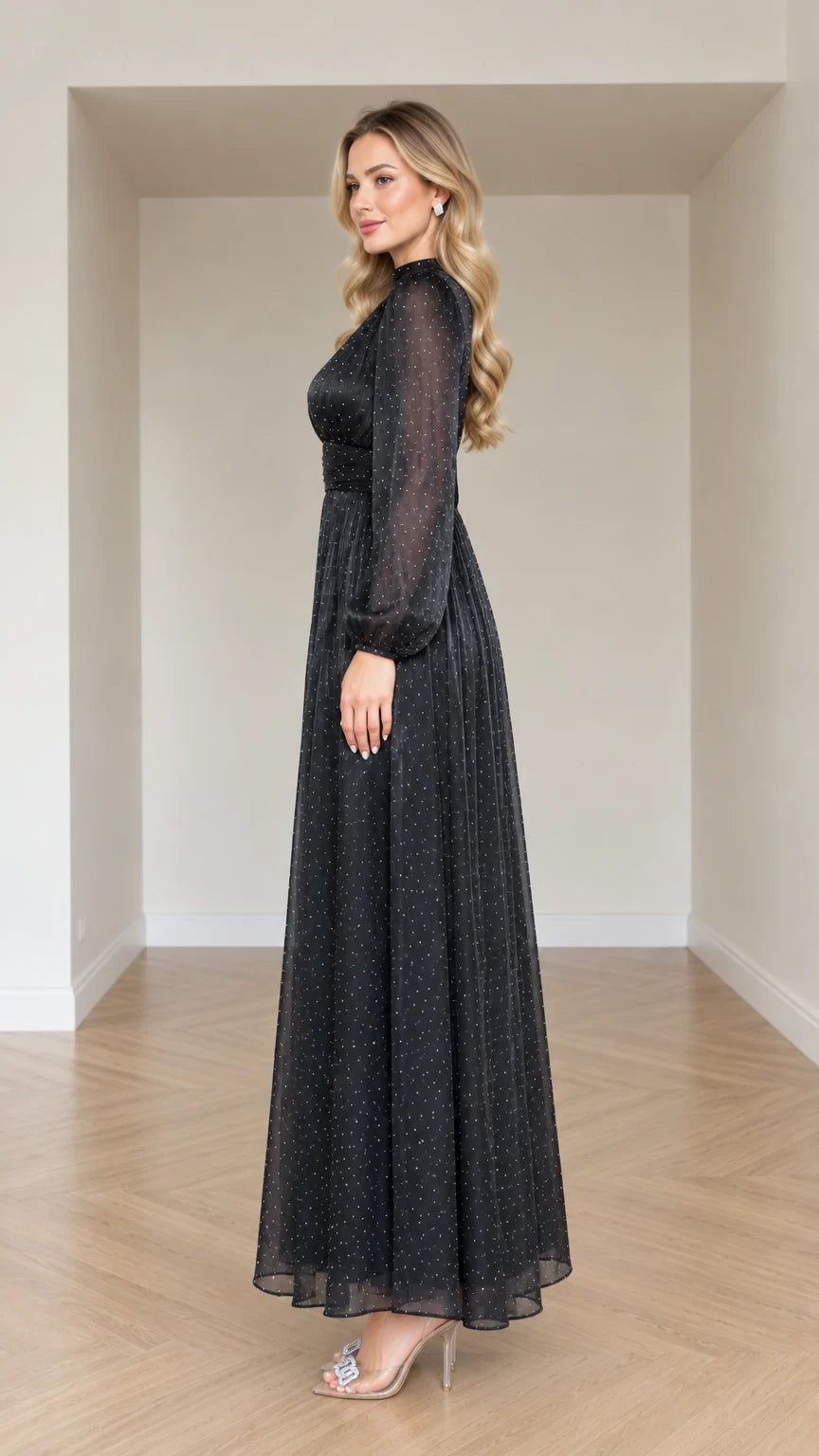 Side profile view of woman modeling Black shimmer long sleeve evening gown