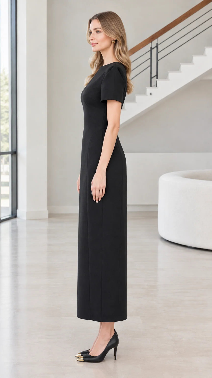 Side view of woman wearing Black short sleeve column maxi dress