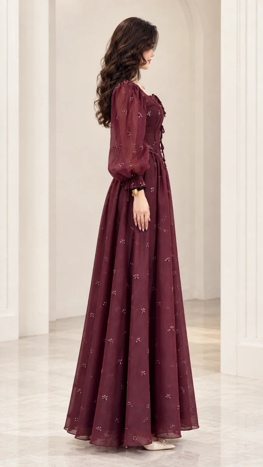 Side profile view of Wine Red lantern sleeve formal maxi dress