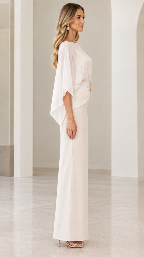 Side profile view of ivory cape overlay formal column gown