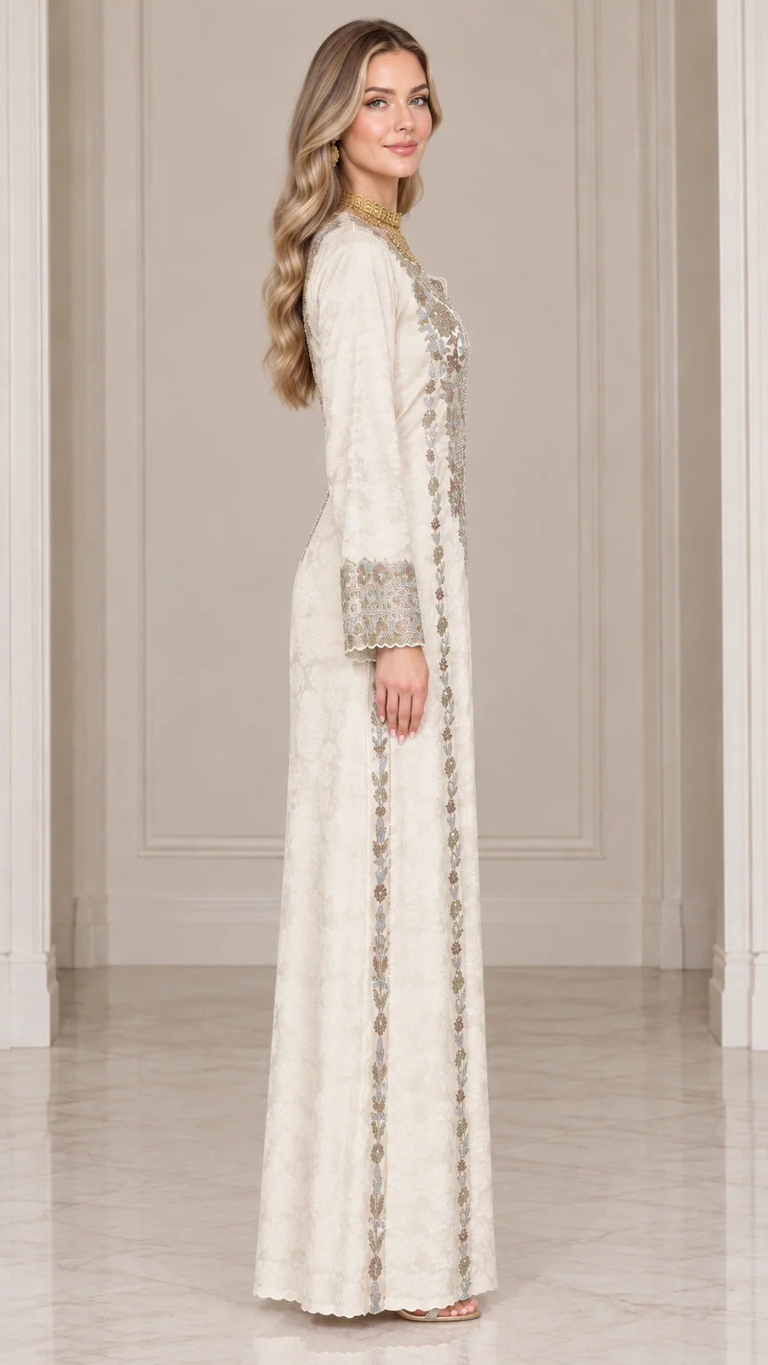 Side profile view of ivory embroidered maxi dress showing long sleeve and straight silhouette