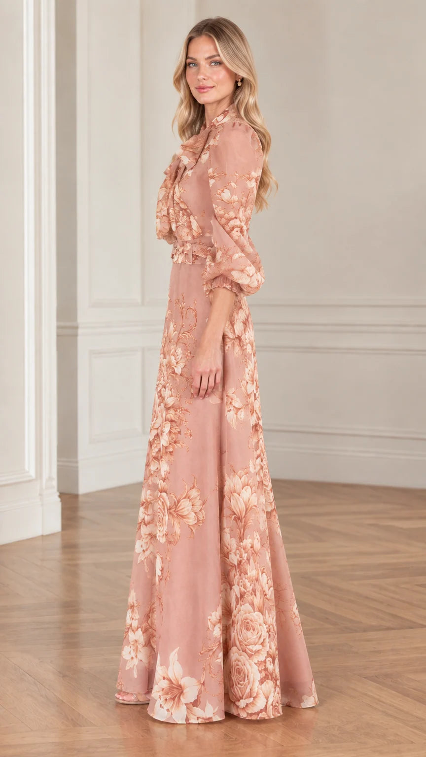 Side profile view of woman modeling dusty rose floral belted maxi gown