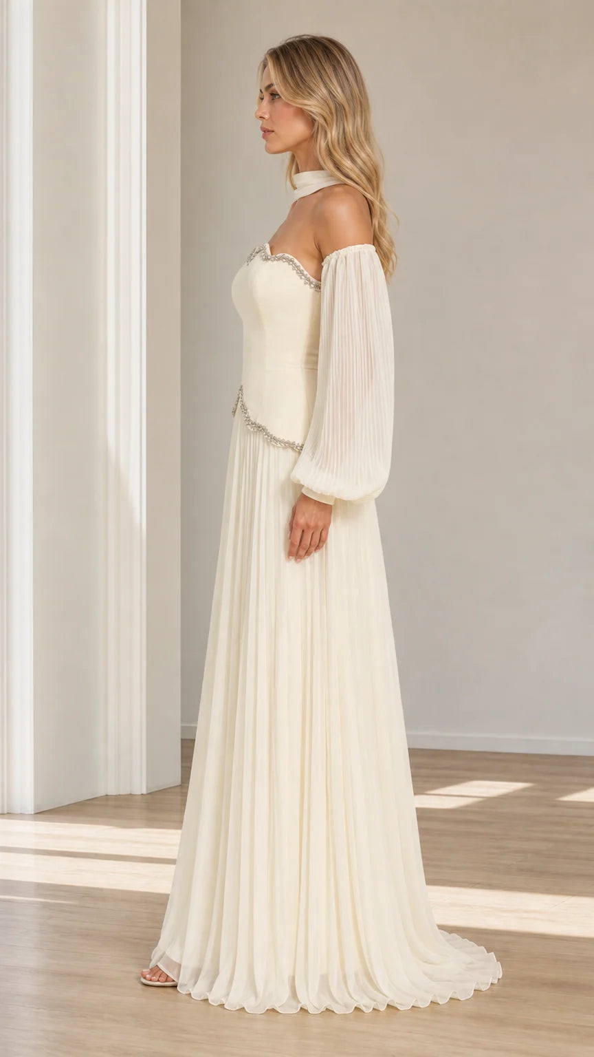 Side profile view of ivory beaded scalloped maxi evening dress with pleated lantern sleeves