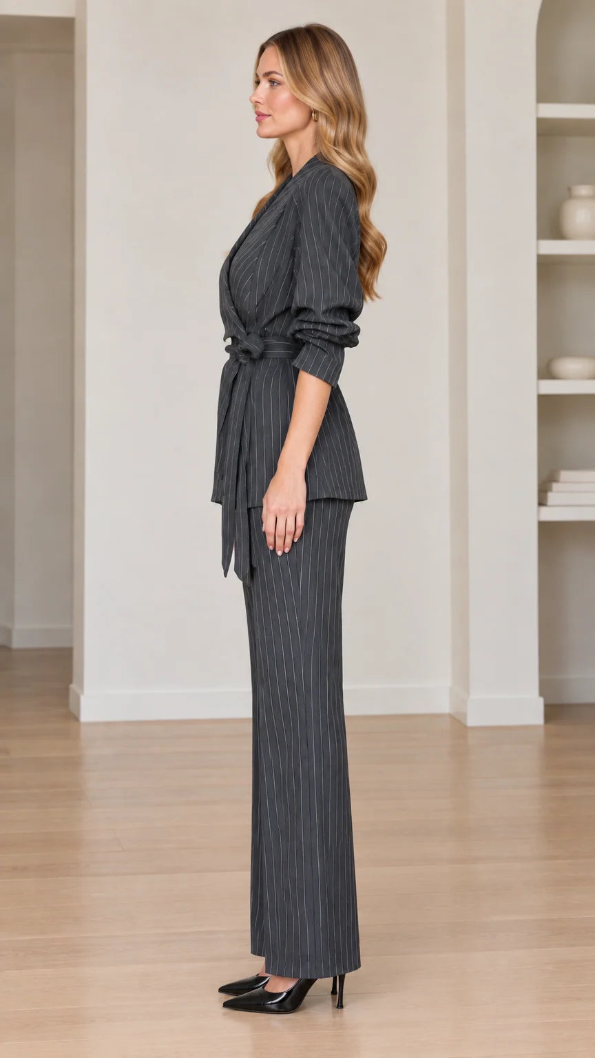 Side profile view of women's charcoal grey pinstripe two-piece suit