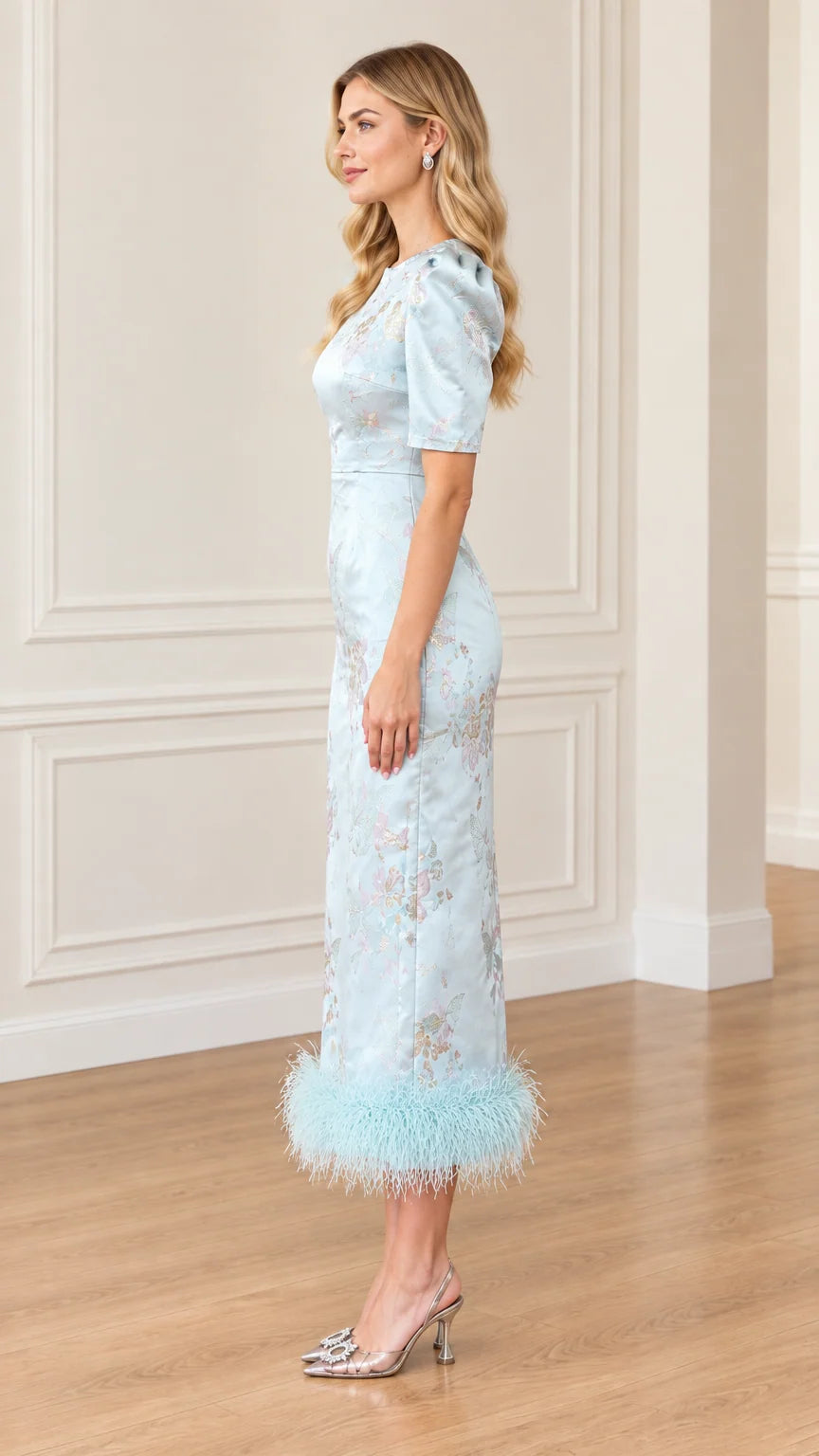 Side profile view of Light Blue jacquard sheath dress with feather trim