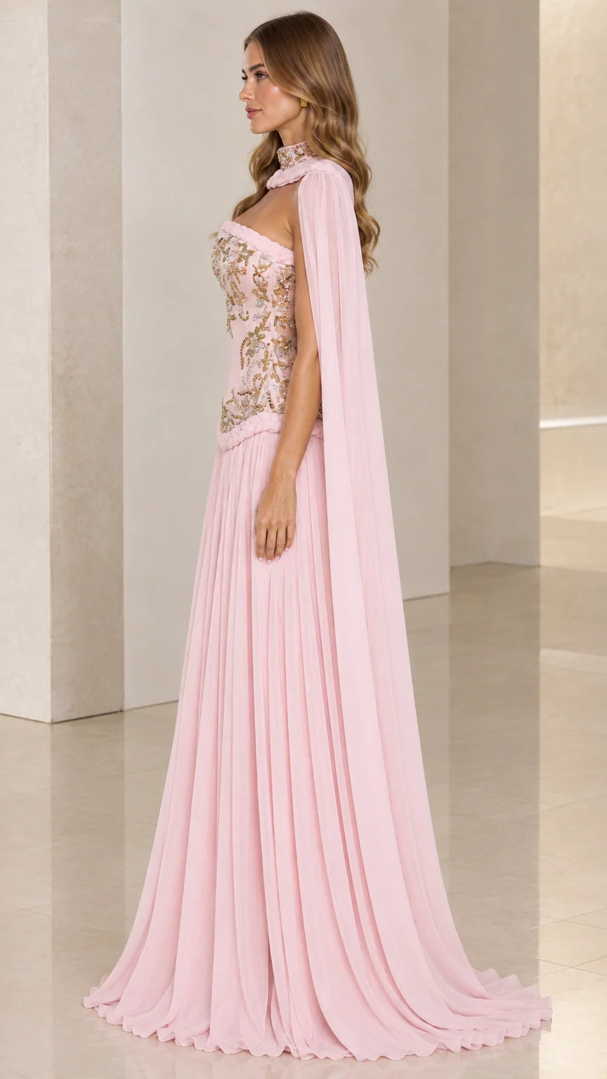 Blush pink formal cape gown side angle showing draped cape and pleated skirt