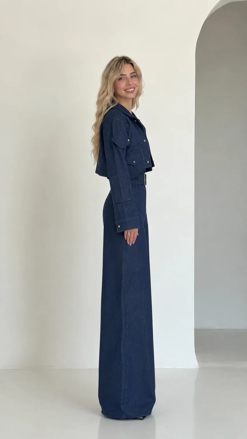 Side profile view of navy blue cropped jacket and high-waisted wide-leg pant set