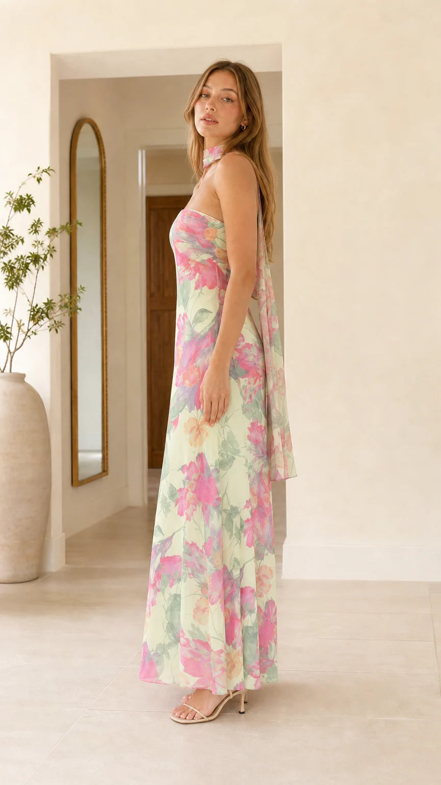 Side profile view of mint green floral maxi dress