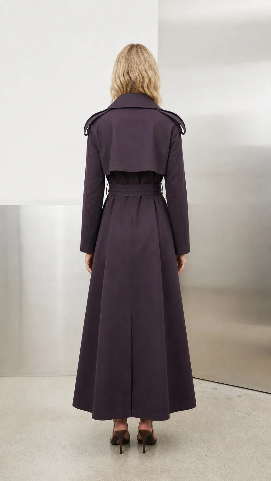 Back view of deep purple maxi trench coat showing back storm flap and vent