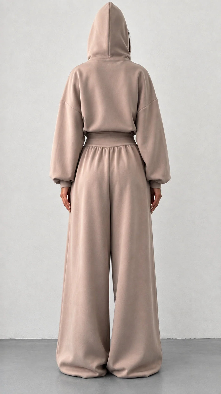 Back view of woman wearing taupe hooded two piece loungewear set