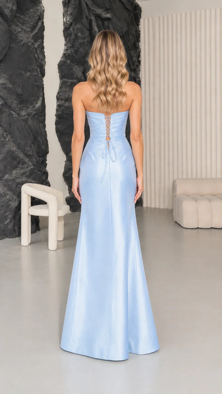 Back view of woman wearing Light Blue maxi dress highlighting lace-up corset detail