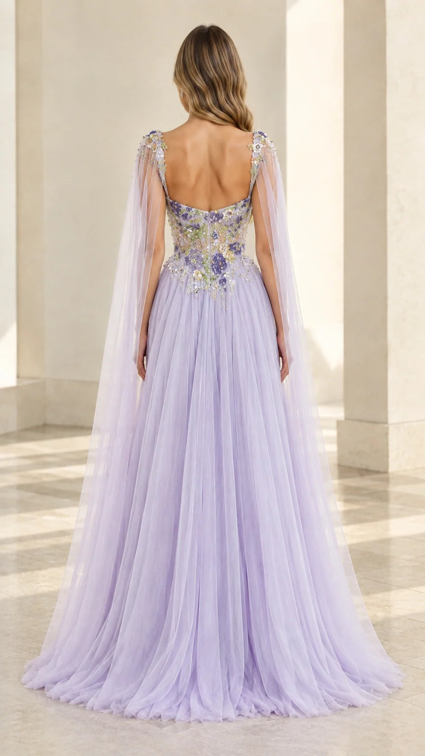 Back view of lavender tulle gown featuring low back and flowing cape train