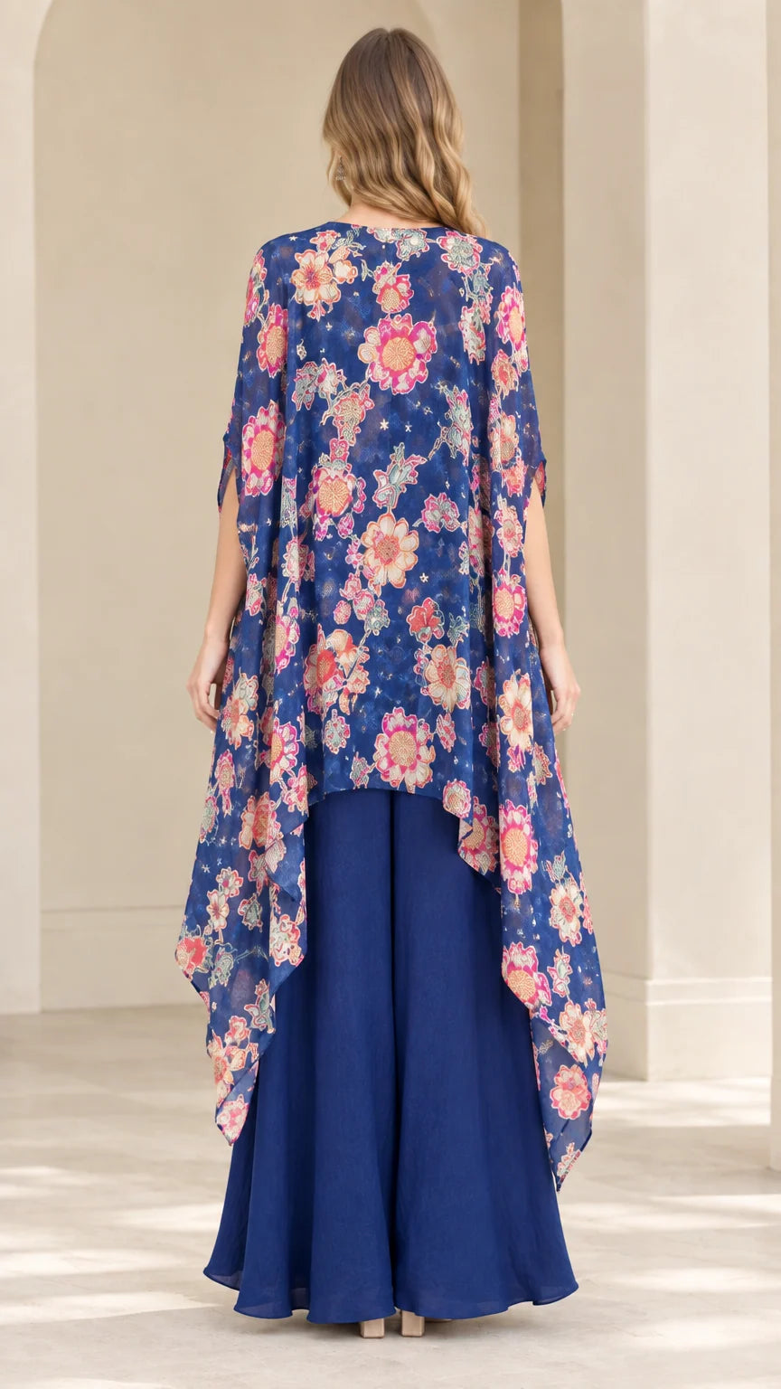 Back view of royal blue sweeping floral duster cape and matching palazzo pants