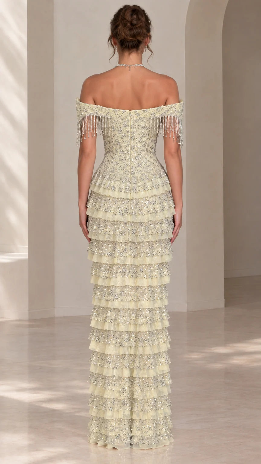 Back view of light yellow off-shoulder tiered evening gown