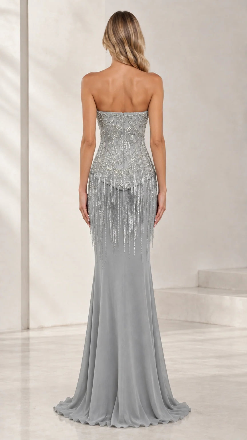 Back view of model wearing strapless floor-length silver gray formal dress