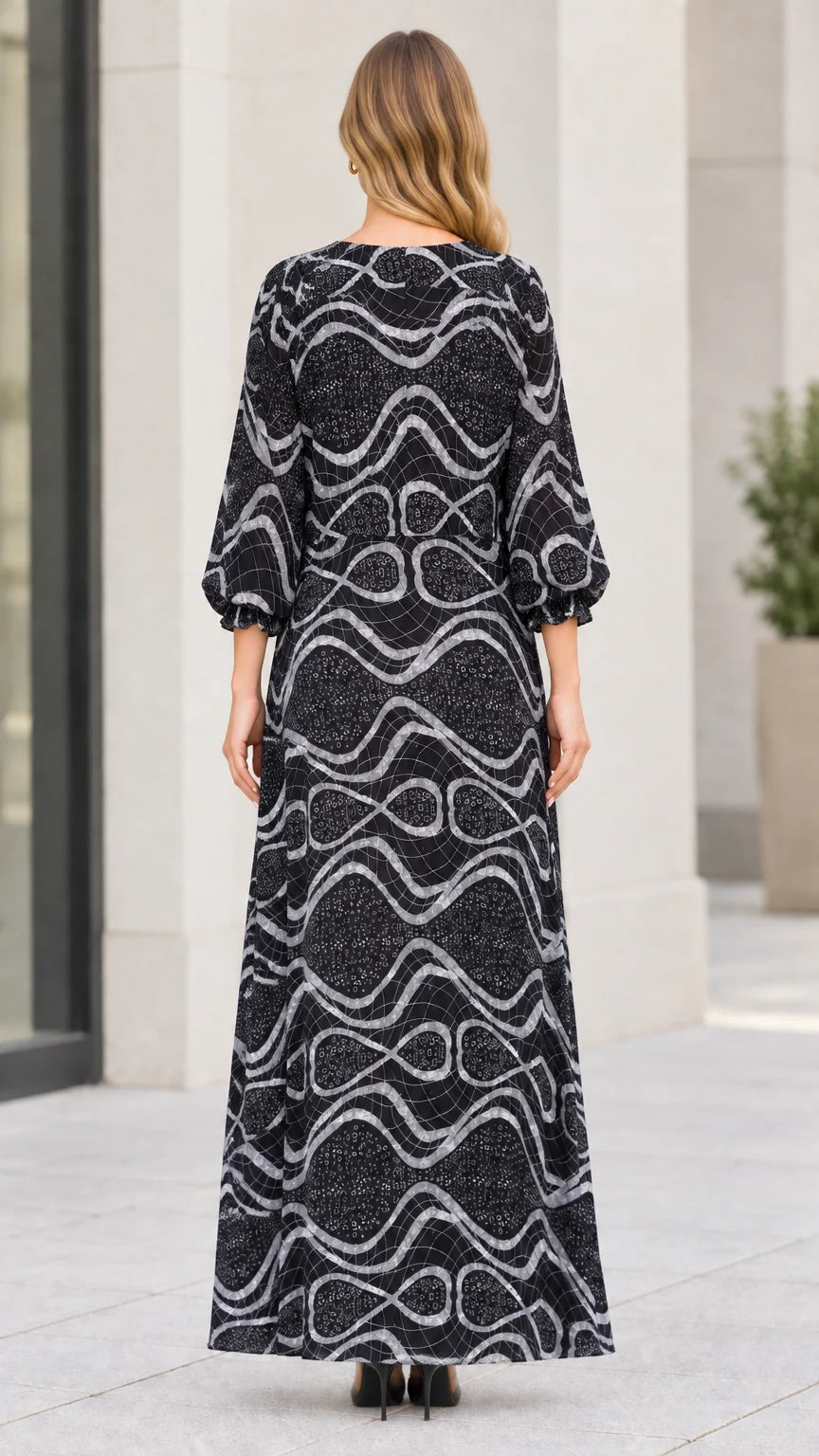 Back view of model wearing long sleeve black wave pattern maxi dress