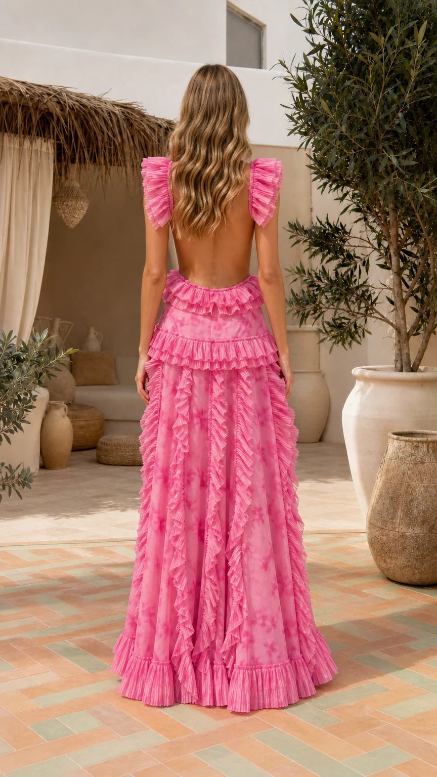 Back view of model showing open back and tiered ruffles