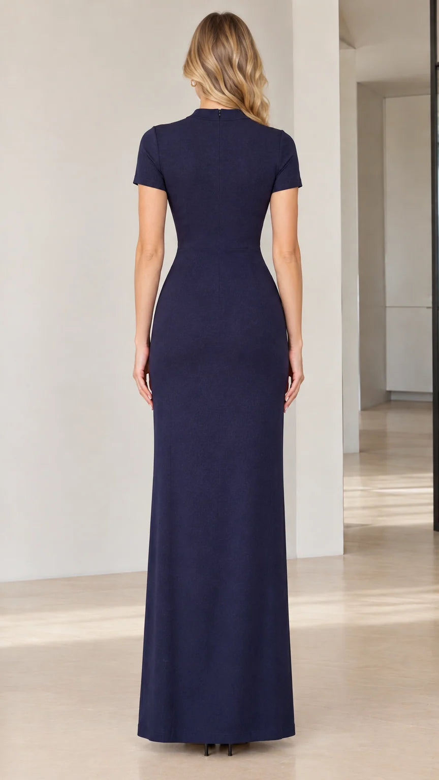 Back view of model in fitted Navy Blue mock neck evening gown