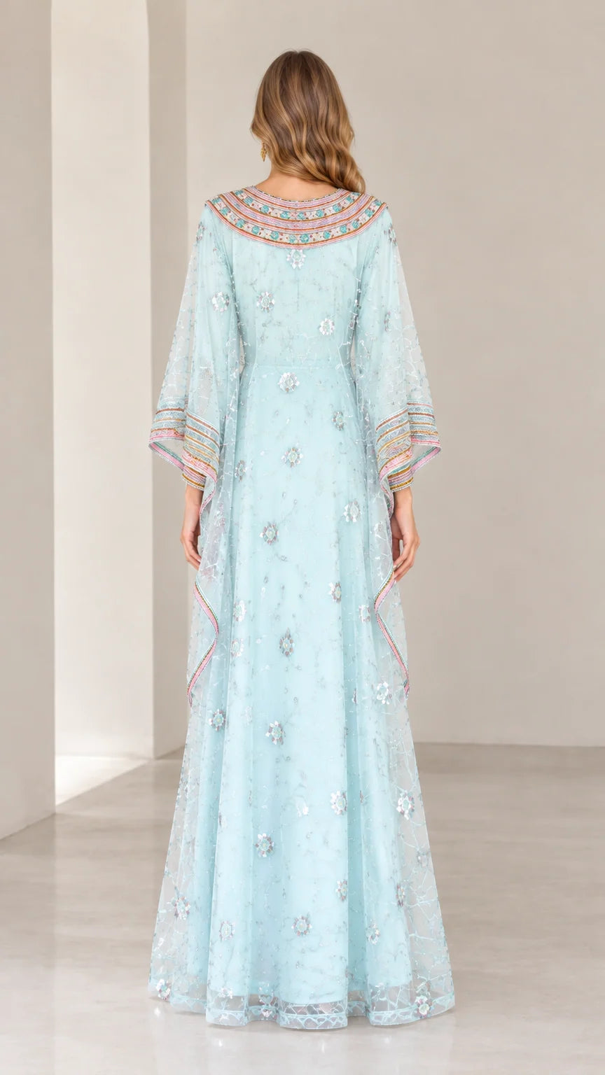 Back view of woman wearing Light Blue embroidered evening kaftan gown