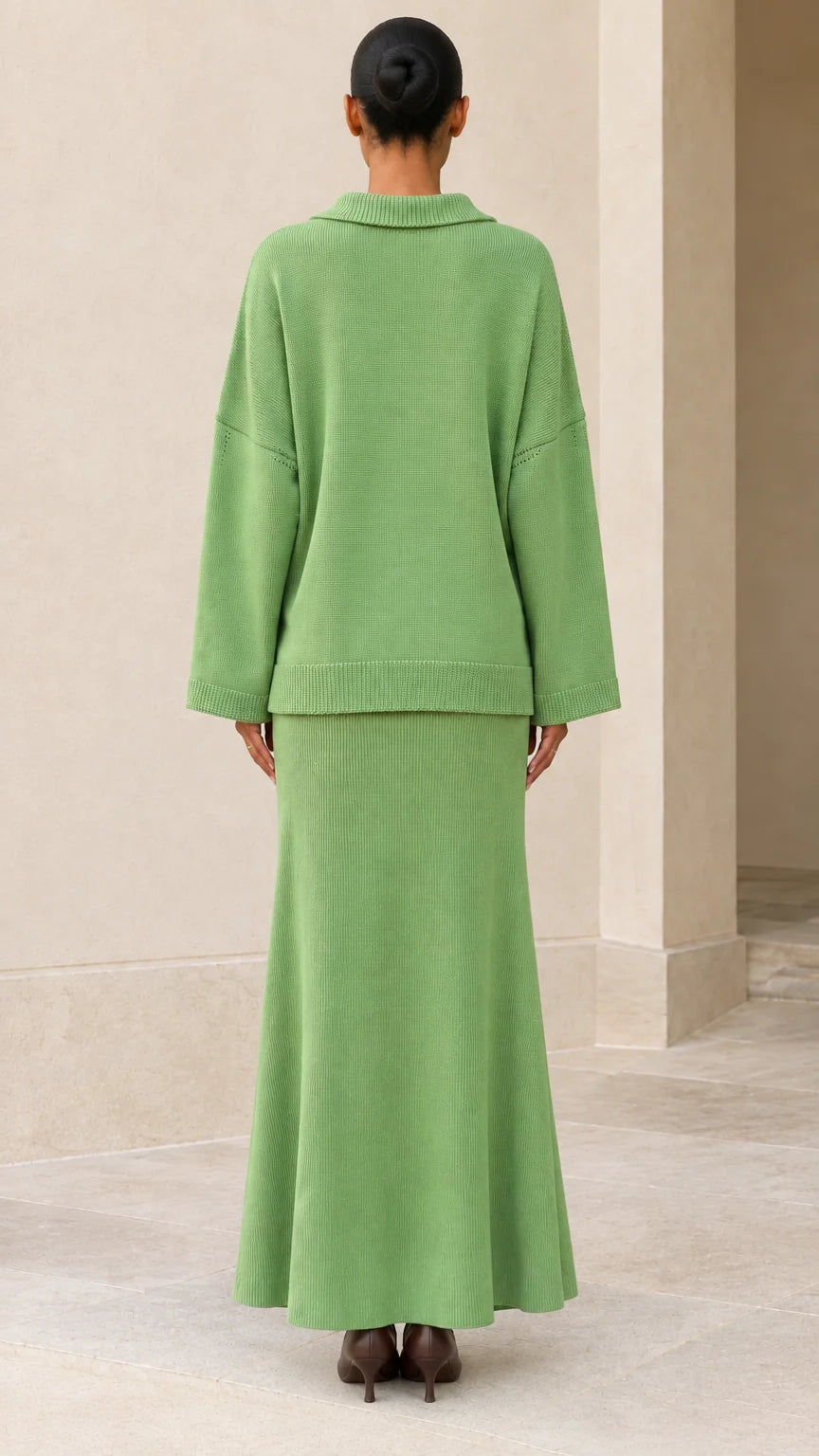 Back view of model wearing relaxed Sage Green knit pullover and maxi skirt