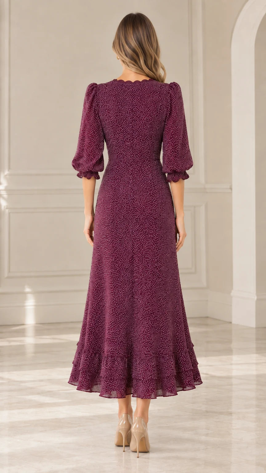 Back view of model wearing Burgundy 3/4 sleeve dotted midi dress