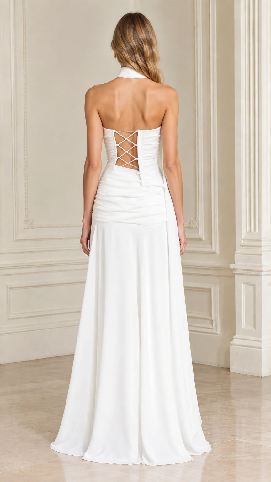 Back view of white formal gown showcasing lace-up corset back detail